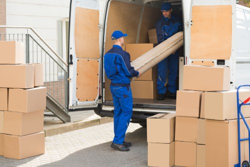 Van loading reusable household items for recycling and donation in Longford