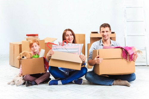 Furniture and boxes being loaded into a van for transport in Longford