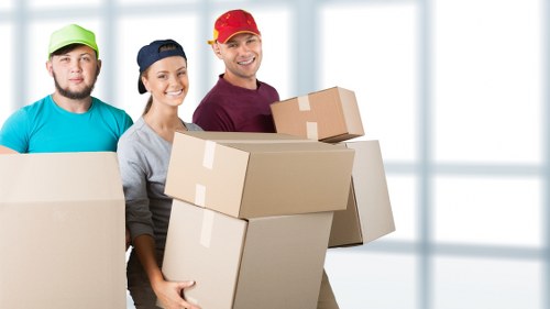 Furniture and household items being loaded into a van in Longford