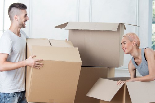 Local removals team handling furniture in a Longford property
