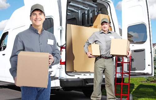 Professional movers packing furniture for transport in Longford