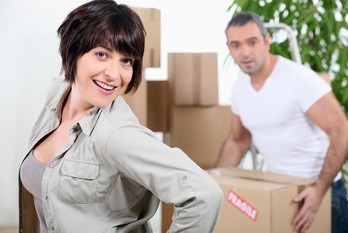 Furniture and boxes being loaded into a removals van