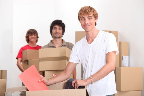 Packed office boxes and furniture ready for relocation in Longford
